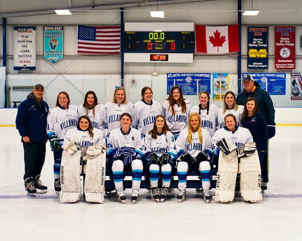 The 2019-2020 Villanova Women's Ice Hockey Team, gathered on ice with their coaches.